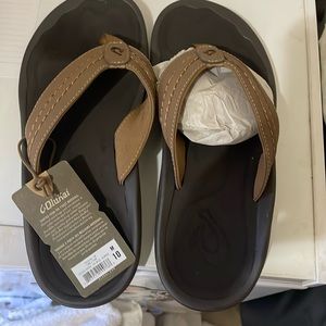 OluKai brown flip flops